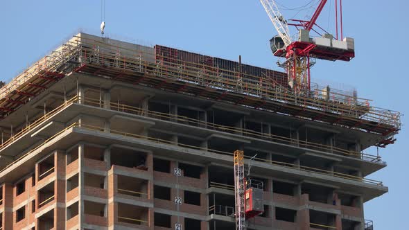 Building Constriction Site with Scaffolding and Crane