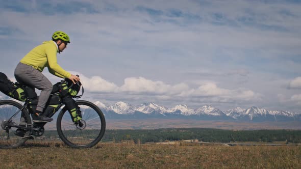 The Man Travel on Mixed Terrain Cycle Touring with Bikepacking