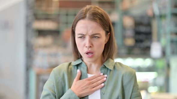 Portrait of Sick Young Woman Coughing