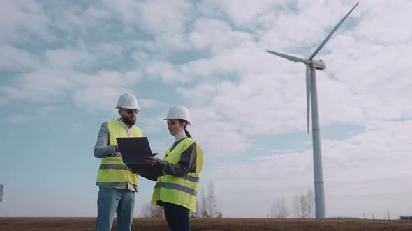 Ecological Engineers Discussing Information at the Windmill Field