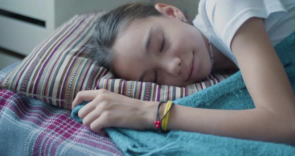 Morning  10Yearold Girl Sleeping Under a Blanket