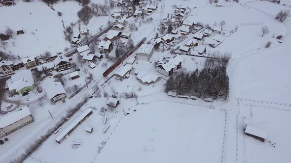Aerial view of a train rolling in Hallstatt on winter