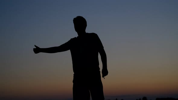 Young Man Hitchhiker Silhouette