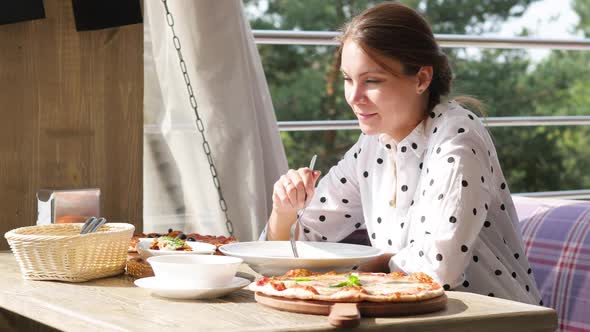 Woman Having Lunch in a Summer Restaurant