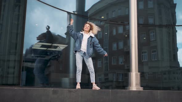 Crazy Dancing in the Street. Cheerful and Happy Girl Dancing and Enjoying Life.