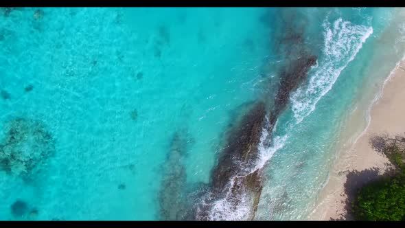 Aerial view seascape of idyllic coast beach holiday by blue green ocean with white sand background o