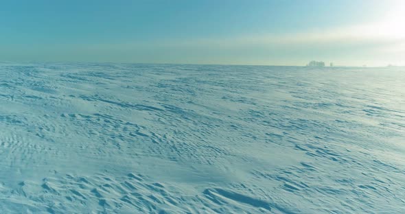 Aerial View of Cold Winter Landscape Arctic Field Trees Covered with Frost Snow Ice River and Sun