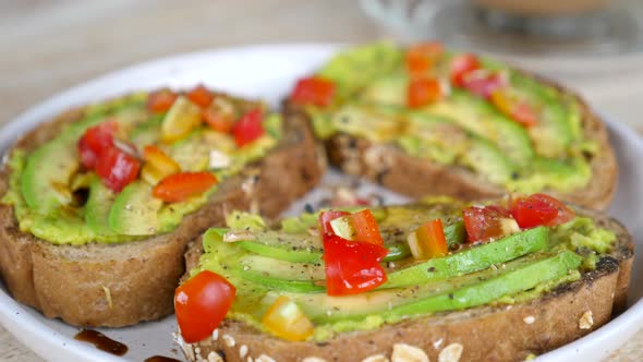 Avocado Toasts on Rye Roasted Sliced Bread with Chopped Cherry Tomatoes