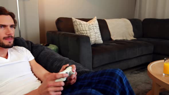 Man playing video games in living room