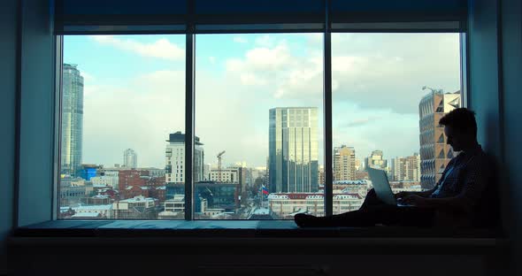 Young Businessman is Doing Freelance Work in Coworking Space