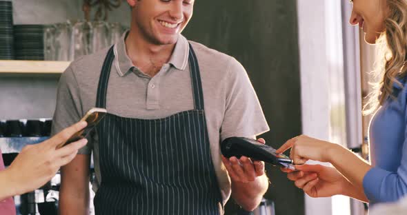 Customer making payment at counter