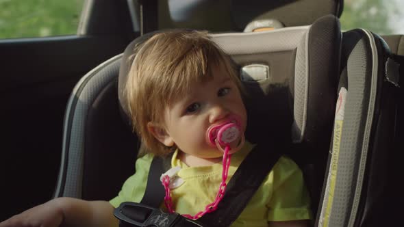 Girl While Traveling in a Car Seat