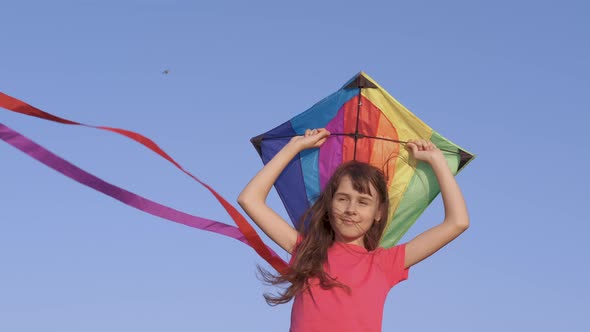 Child in the wind with a fly toy. 