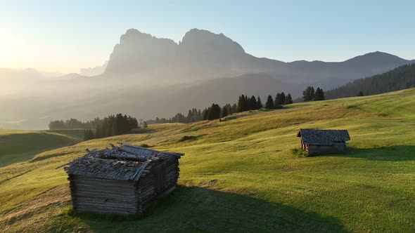 Sunrise in the Dolomites mountains with fog and mist