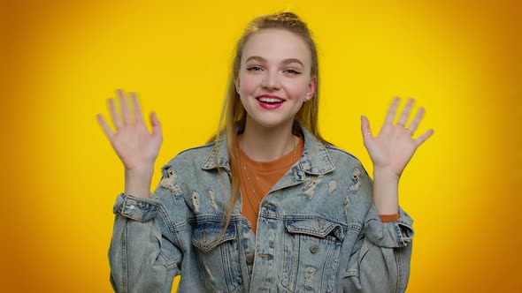 Girl Teenager Smiling Friendly at Camera and Waving Hands Gesturing Hello or Goodbye Welcoming