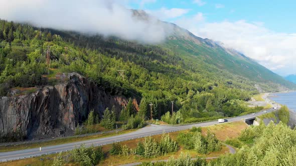 4K Drone Video of Alaska Route 1 Along Mountain Shoreline of Turnagain Arm