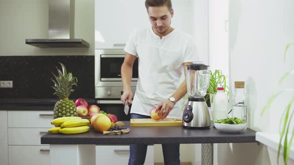 Man Cut an Apple To Make the Smoothie