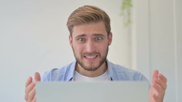 Portrait of Creative Man Talking on Video Call on Laptop