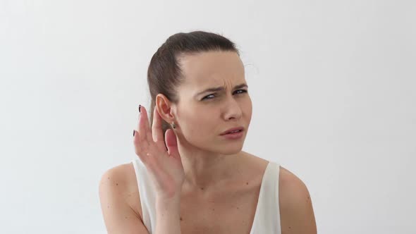 Woman Listen Carefully Hand on Ear Portrait