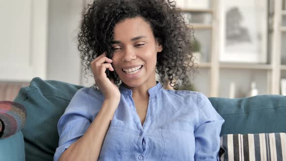 African Woman Talking on Phone