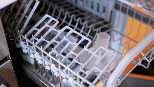 Open Dishwasher Compartment with Hand and RemoveItem