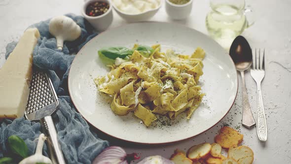 Cooked Homemade Pasta with Pesto Fresh Basil Mozarella Cheese and Herbs