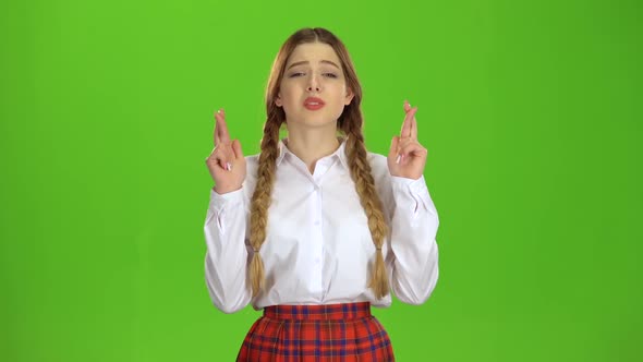 Girl Crossed Her Fingers. Green Screen