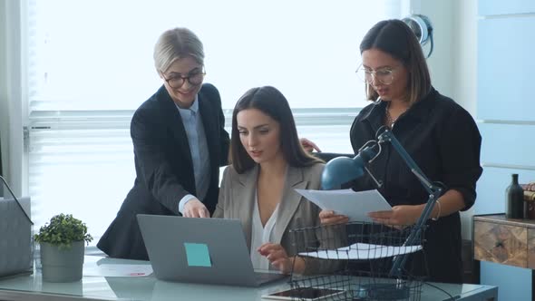 Confident young businesswoman presenting new business project to partners in modern office