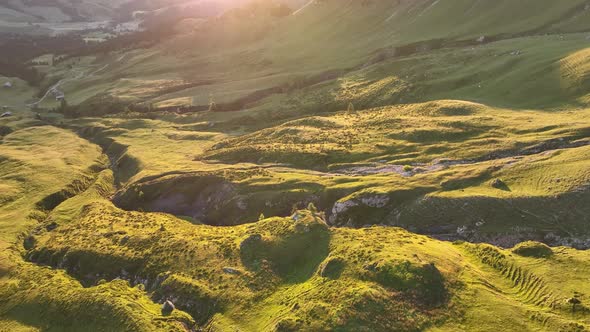 Dolomites mountains peaks with a hiking path on a summer sunrise