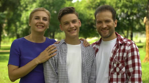 Cheerful Family Smiling Showing Thumbs-Up, Lucrative Loans, Credits for Studying