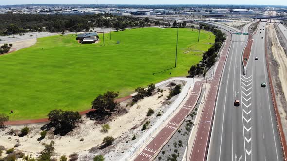 Aerial View of a Busy Freeway near an Oval in Australia