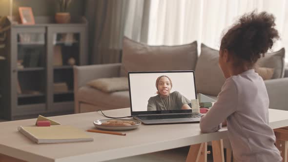 Little Girl Video Chatting with Military Mother alt