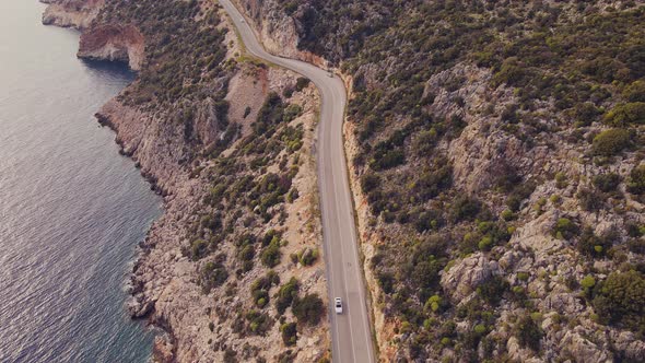 Aerial view of Coast Highway between sea and rocks