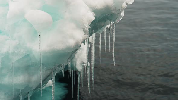 Icicles On Iceberg Over Sea