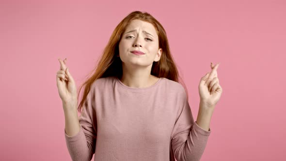 Cute Young Girl Praying Over Pink Background. Woman Begging Someone Satisfy Her Desires, Help With.