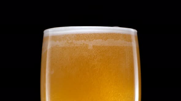 Light Beer is Pouring Into Glass