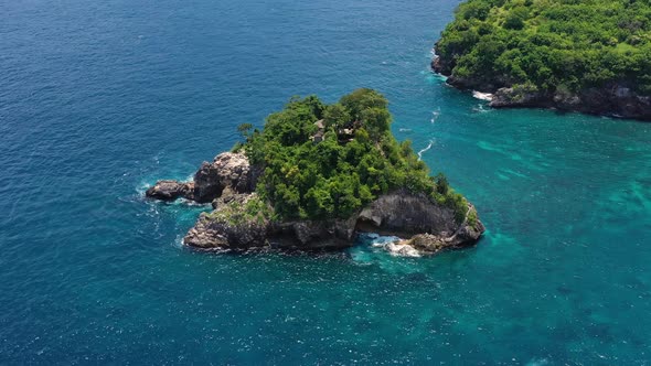 Aerial view at sea and rocks. Nusa Penida, Bali, Indonesia. Seascape from air