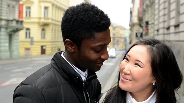 Happy Couple Smile To Camera - Black Man and Asian Woman - Urban Street with Car - Closeup