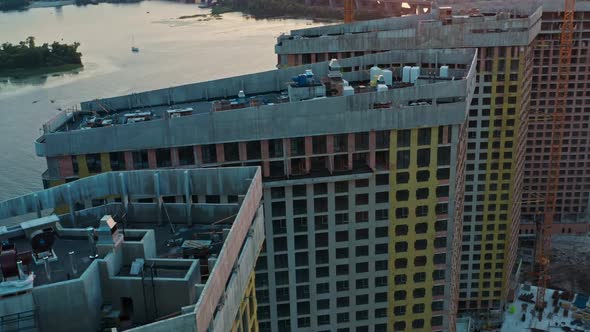 Top Aerial View of Constructions Site with Modern Buildings at Sunset