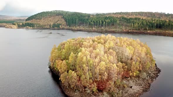 Flying Over Island in Loch Garry in the Scottish Highlands, Scotland