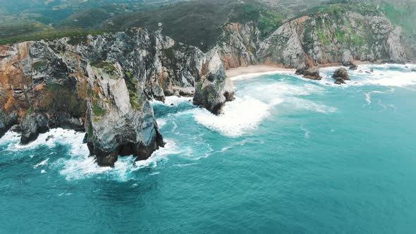 Beautiful Ocean Waves Roll on Hilly Coast on Windy Day