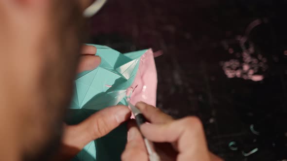 Close-up: a man works with a blade. Production of decorative elements. Workshop.