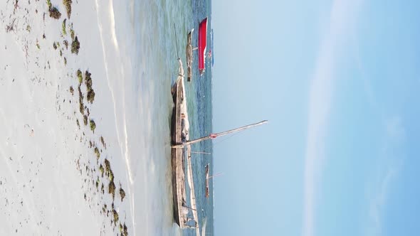 Tanzania Vertical Video  Boat Boats in the Ocean Near the Coast of Zanzibar Aerial View