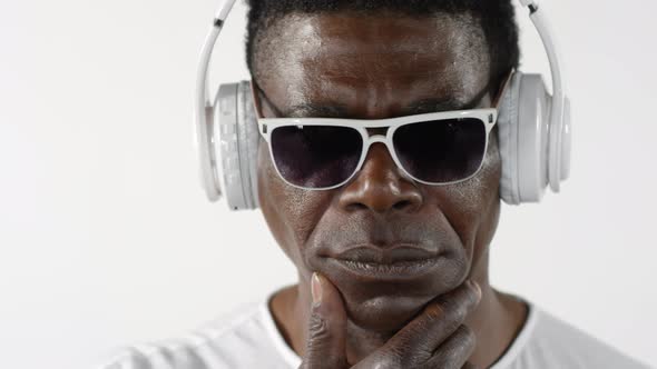 Cool African American Man Listening to Music with Headphones