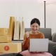 Happy young Asian woman enjoy to shopping from online shopping platform by laptop computer. - VideoHive Item for Sale