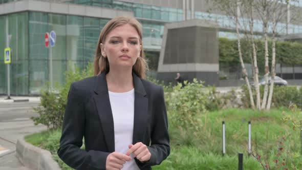 Businesswoman Thinking While Standing Outside