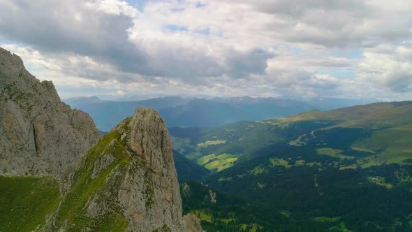 Rough grass covered South Tyrol Plose Peitlerkofel mountain peak aerial view looking down to breath