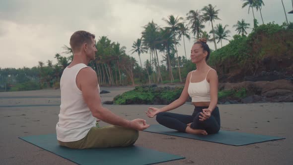 People Meditating on Tropical beach