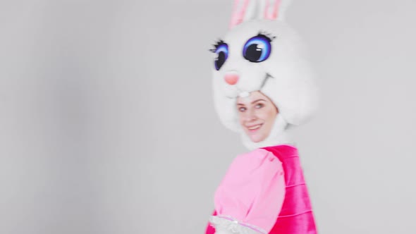 Portrait of a young cute girl in a beautiful hare costume