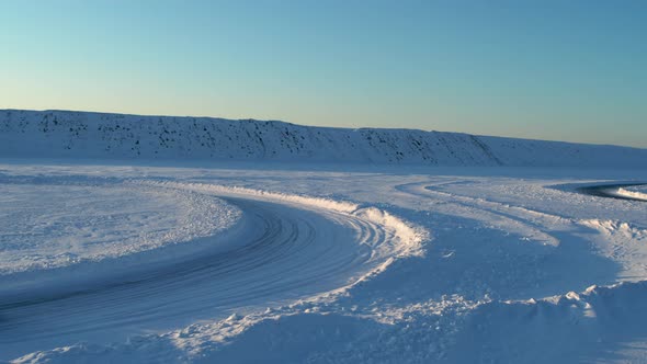 Aerial View of an Ice Rally on a Snowy Track